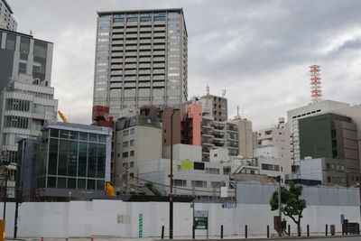 Modern buildings in city against sky