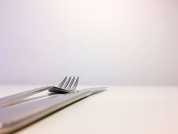 High angle view of container on table against white background