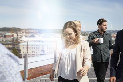 Business people having coffee break on rooftop