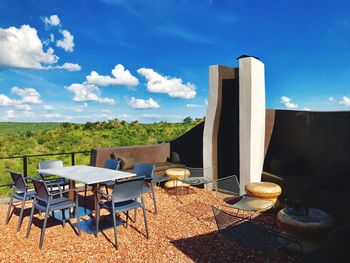 Chairs and table against sky at singitta lodge kruger safari 