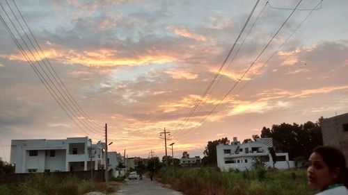 View of residential district against cloudy sky