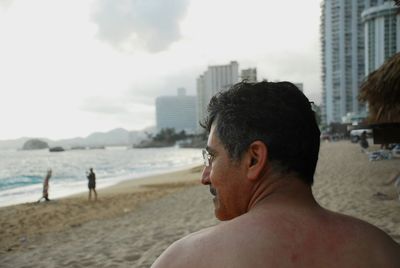 Rear view of man at beach