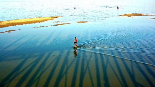 Reflection of people in water