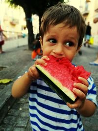 Portrait of boy eating ice cream