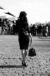 Rear view of woman walking outdoors