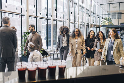 Group of male and female business professionals during networking event at convention center