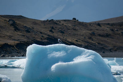 Scenic view of iceberg against sky