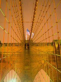 Illuminated bridge in city