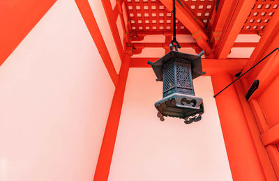 Old metal lanterns at the entrance to the shrine gate in japan