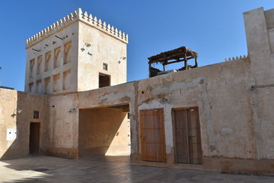 Low angle view of historic building against clear sky