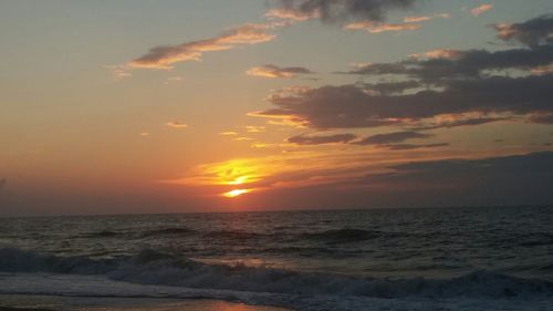 Scenic view of sea at sunset