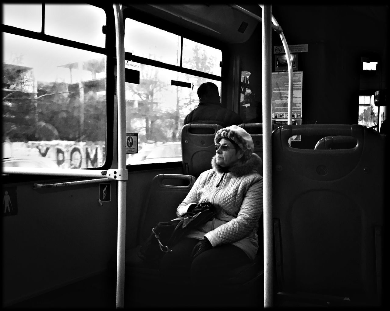 sitting, vehicle interior, transportation, real people, public transportation, train - vehicle, mode of transport, bus, land vehicle, vehicle seat, window, two people, day, looking through window, lifestyles, men, outdoors, people