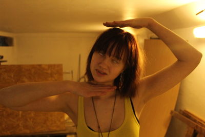 Portrait of woman standing at home