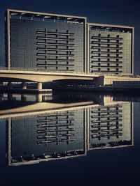 Modern building reflection in water
