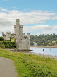 Scenic view of sea against sky with castle