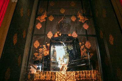 Low angle view of illuminated chandelier in building