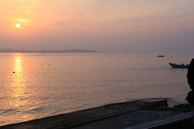 Scenic view of sea against sky during sunset