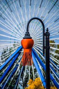 Close-up of red fire hydrant against blue sky