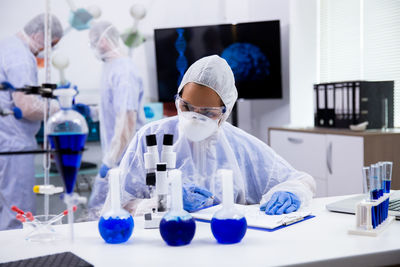 Portrait of scientist examining chemical in laboratory