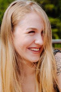 Close-up portrait of a smiling young woman