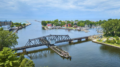 Boats in sea against sky