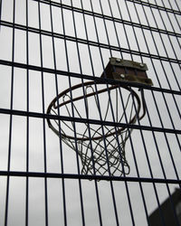 Low angle view of metal structure against building