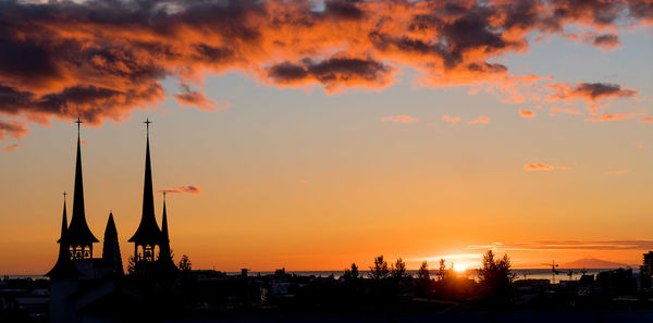 Silhouette of buildings at sunset