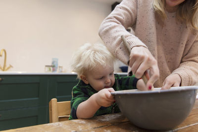 Midsection of woman preparing food for baby