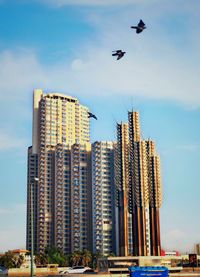 Low angle view of modern buildings against sky