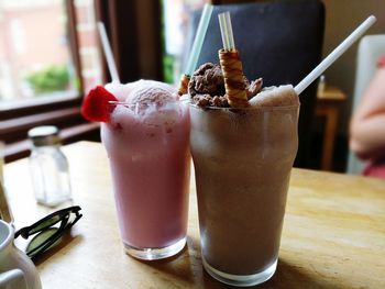 Close-up of dessert in glasses on table