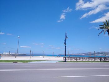 View of highway against blue sky