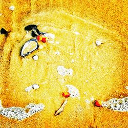 High angle view of footprints on beach