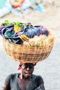 Close-up of man holding ice cream in basket