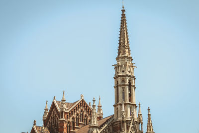 Low angle view of traditional building against blue sky