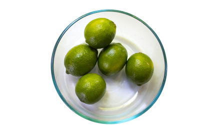 High angle view of fruits in bowl over white background