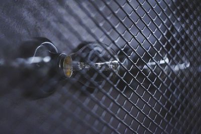 Close-up of water drops on metal