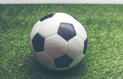 High angle view of soccer ball on grassy field