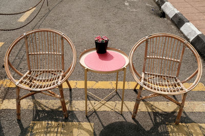 High angle view of empty chair on table