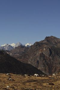 Arid alpine landscape and snowcapped himalaya mountains near bum la pass in tawang, north east india 