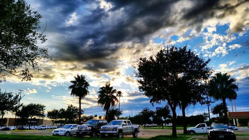 Parking lot against cloudy sky