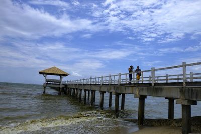 Pier over sea against sky