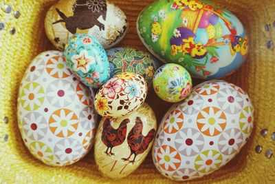 High angle view of multi colored eggs on table