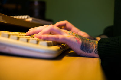 Close-up of person hand on table