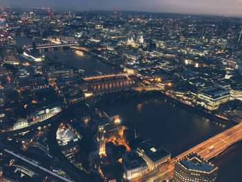 High angle view of illuminated city buildings at night