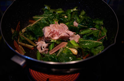 High angle view of the ingredient in the cooking pan on the stove