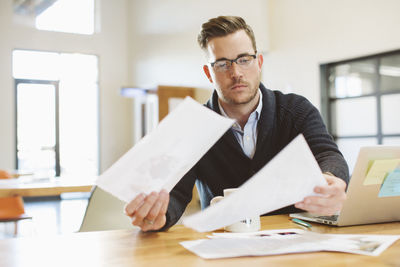 Businessman working at desk in office