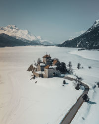 Scenic view of snowcapped mountains against sky