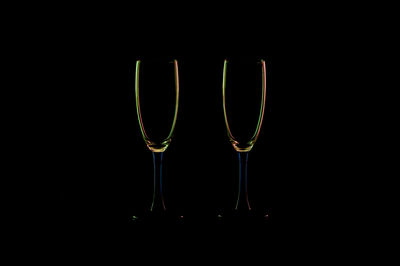 Close-up of wine glass against black background