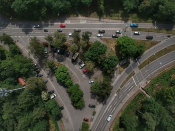 High angle view of cars moving on road during sunny day