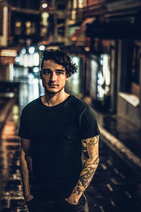 Portrait of young man standing outdoors
